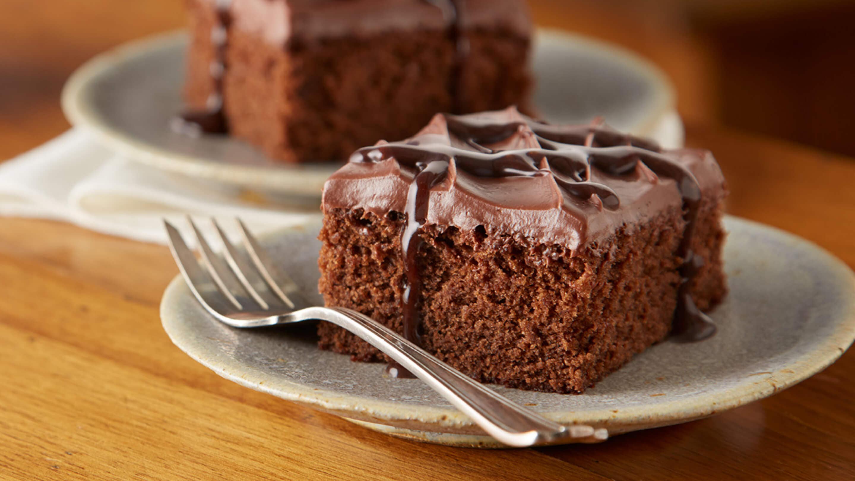 Chocolate cake and brownies drizzled with chocolate syrup
